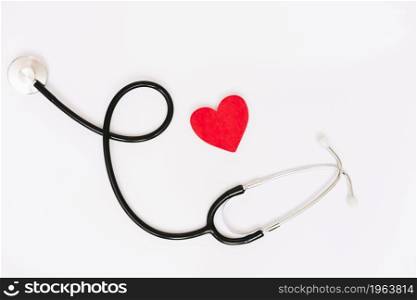 paper heart near stethoscope. High resolution photo. paper heart near stethoscope. High quality photo