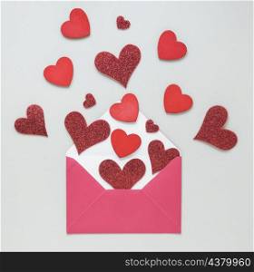paper hearts scattered from envelope