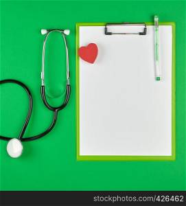 paper holder with empty white sheets, medical stethoscope on green background, top view, space for writing a prescription