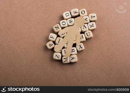 Paper man and letter cubes of made of wood