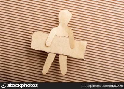 Paper man shape holding burnt note paper in hand