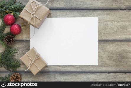 paper near present boxes and fir branch . Resolution and high quality beautiful photo. paper near present boxes and fir branch . High quality and resolution beautiful photo concept