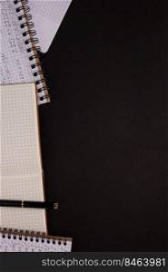 Paper notebook at black background texture. Creative idea concept