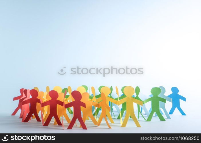 Paper people in LGBT rainbow colors on a blue background.