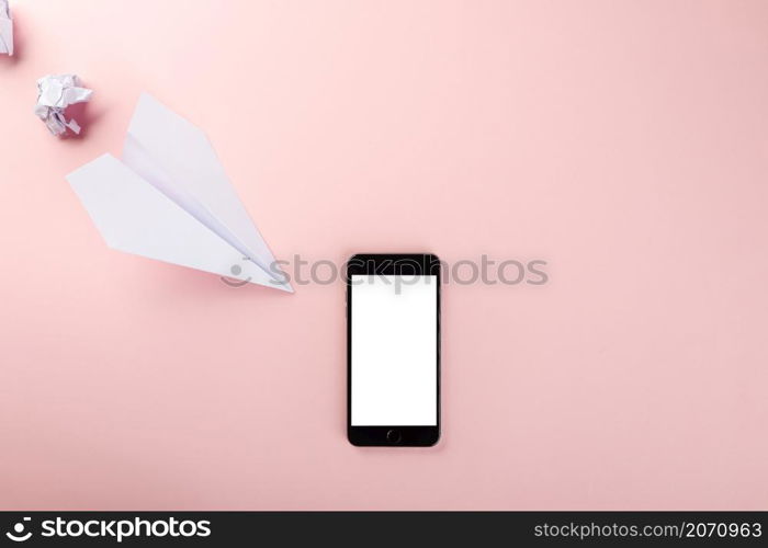 Paper plane letter document message. Top view mock up design of airplane travel and mobile phone, education or innovation origami plane with smartphone blank screen, isolated on pink background