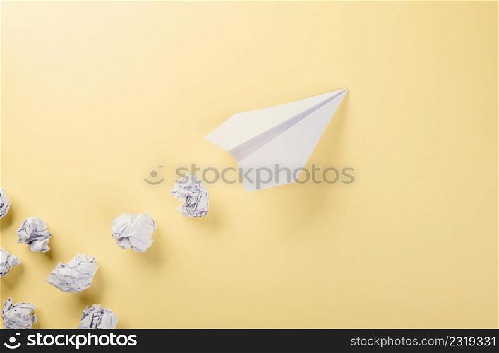 Paper plane letter document message. Top view mock up design of airplane travel, education or innovation origami plane, isolated on yellow background with blank empty space for copy space