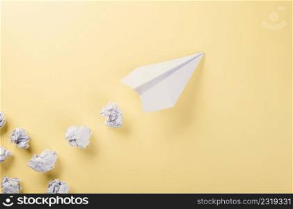Paper plane letter document message. Top view mock up design of airplane travel, education or innovation origami plane, isolated on yellow background with blank empty space for copy space