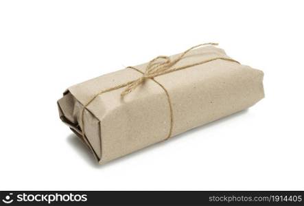 paper roll packaging tied with brown rope and isolated on white background