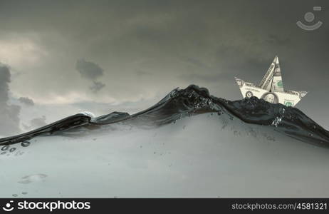 Paper ship. Paper ship floating on water on stormy waves