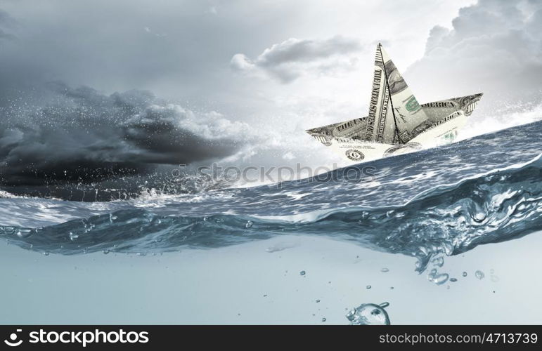 Paper ship. Paper ship floating on water on stormy waves