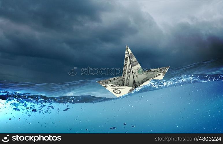 Paper ship. Paper ship floating on water on stormy waves