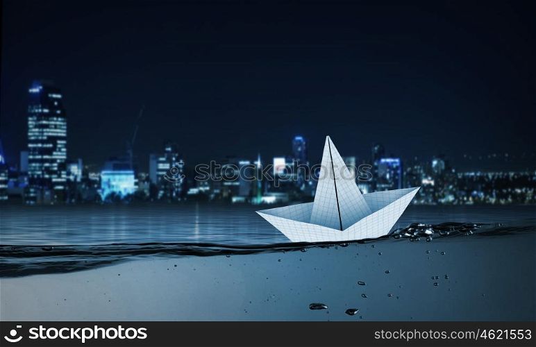 Paper ship. Paper ship floating on water on waves