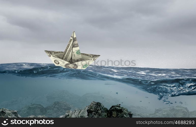 Paper ship. Paper ship floating on water on waves