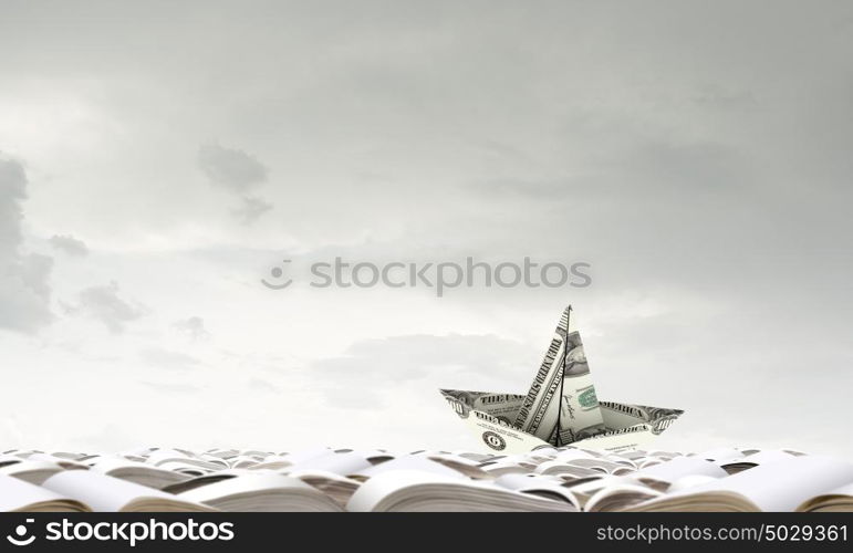 Paper ship. Paper ship floating on water on waves