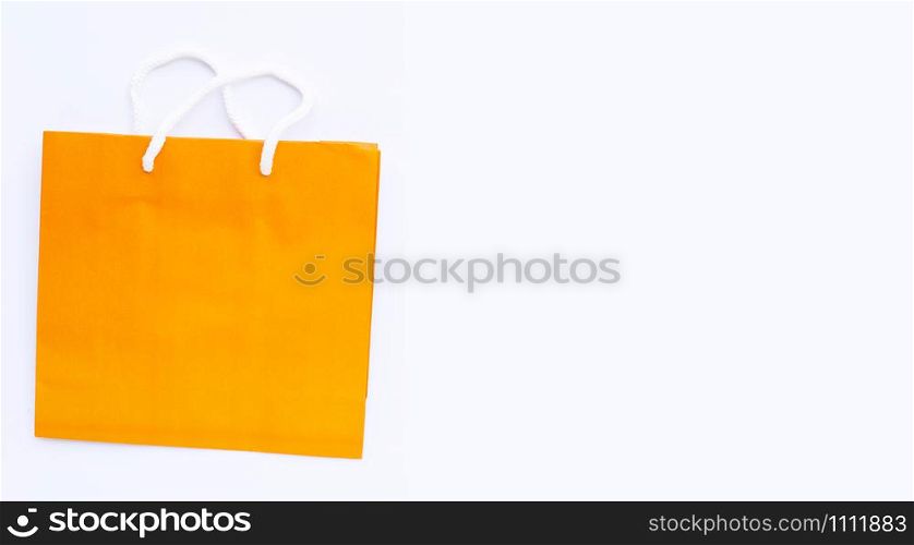 Paper shopping bag on white background. Copy space