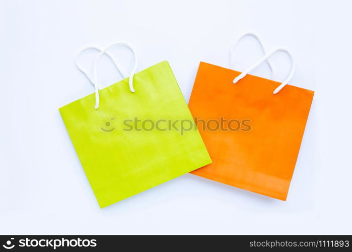 Paper shopping bags on white background. Top view