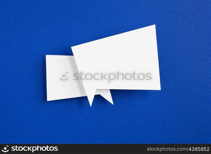 paper speech bubble on blue background