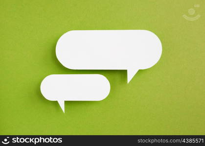 paper speech bubble on green background