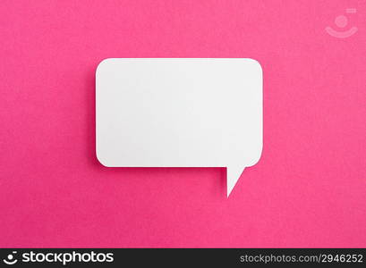 paper speech bubble on pink background