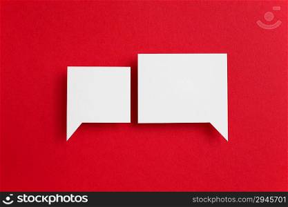 paper speech bubble on red background