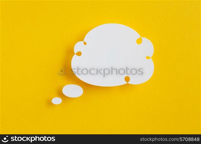 paper speech bubble on yellow background