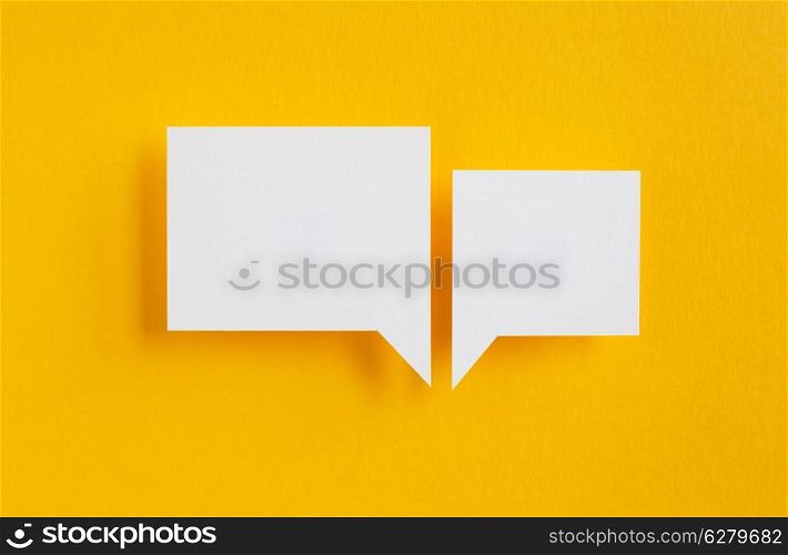 paper speech bubbles on yellow background