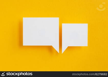 paper speech bubbles on yellow background