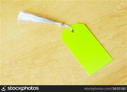 paper tag isolated on a wooden background