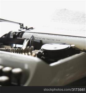 Paper with text inside typewriter.