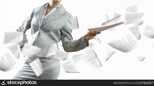 Paperwork. Close up of businesswoman holding papers in hands