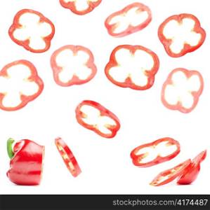 paprica slices are flying in the air, isolated on white