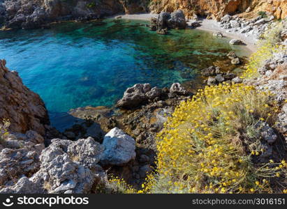 Paradise sea bay with azure water and beach. View from coastline trail of Zingaro Nature Reserve Park, between San Vito lo Capo and Scopello, Trapani province, Sicily, Italy
