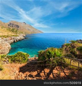 Paradise sea bay with azure water and beach view from coastline trail of Zingaro Nature Reserve Park, between San Vito lo Capo and Scopello, Trapani province, Sicily, Italy