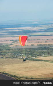 Paragliding in mountains. Paragliding in mountains. Para gliders in fight in the mountains, extreme sport activity.