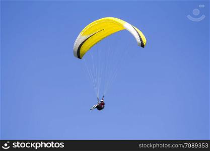 Paragliding in the blue sky as background extreme sport