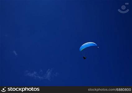 Paragliding sport. Paraglider at the blue sky