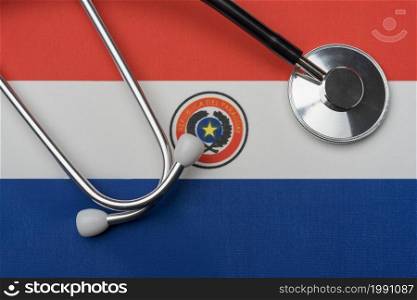 Paraguay flag and stethoscope. The concept of medicine. Stethoscope on the flag as a background.. Paraguay flag and stethoscope. The concept of medicine.