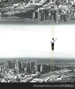 Parallel worlds. Businessman standing on ladder between two realities