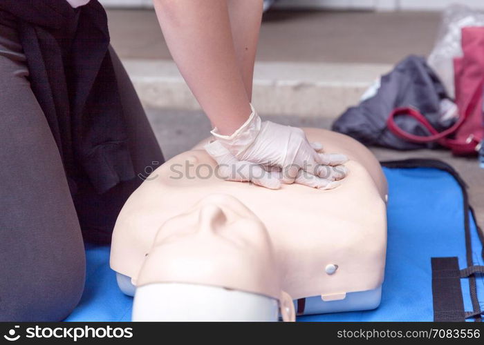 Paramedic demonstrate Cardiopulmonary resuscitation - CPR on dummy. First aid training.