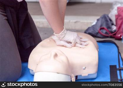 Paramedic demonstrate Cardiopulmonary resuscitation - CPR on dummy. First aid training.