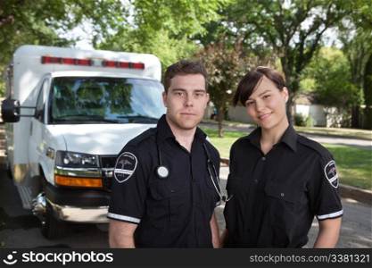 Paramedic team portrait with ambulance in background