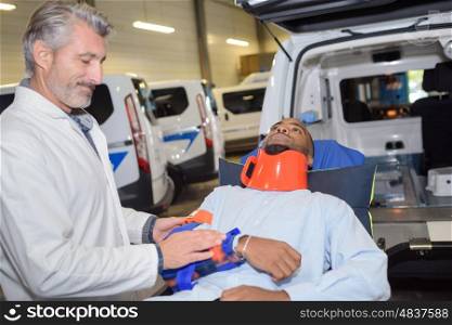 Paramedic tending to injured patient