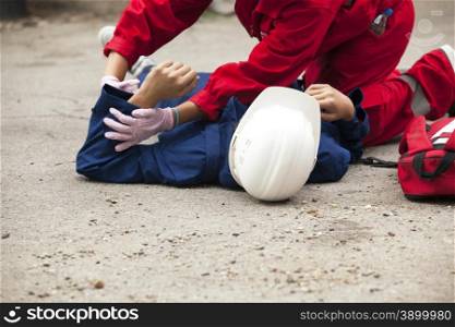 Paramedics providing first aid to an injured person