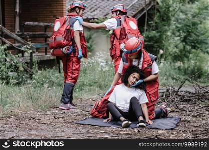 Paramedics rescuing disaster victim