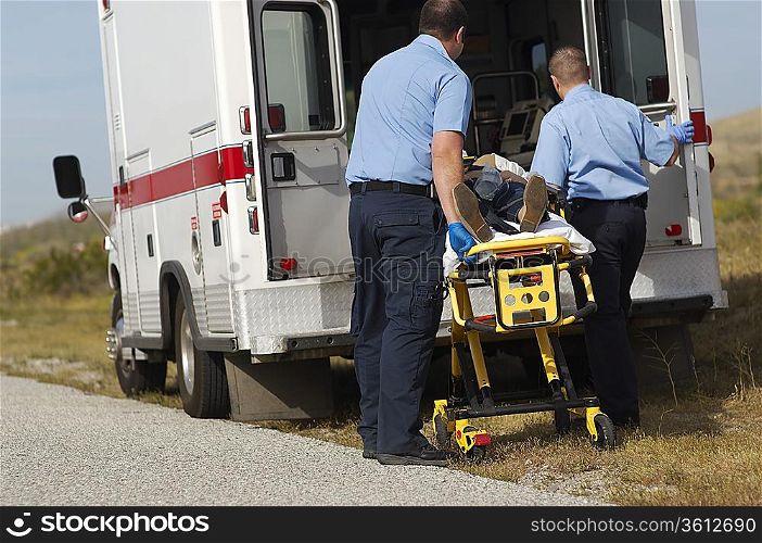 Paramedics transporting victim on stretcher