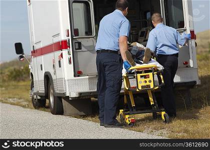 Paramedics transporting victim on stretcher