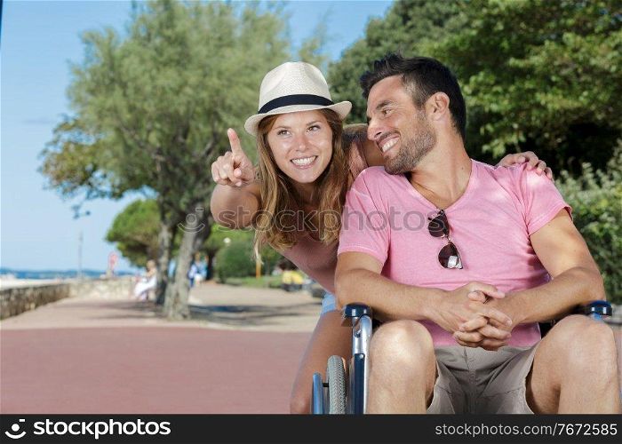 paraplegic man in wheelchair and girfriend