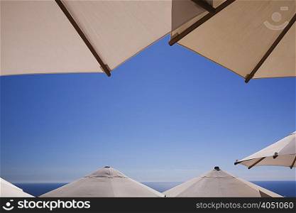 Parasols with clear blue sky and sea