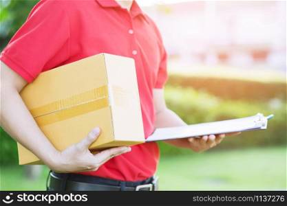 parcel delivery man of a package through a service. in hand Prepare to send a delivery of boxes from delivery man.