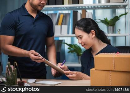 parcel delivery service for work from home people, Woman receiving parcel from delivery man